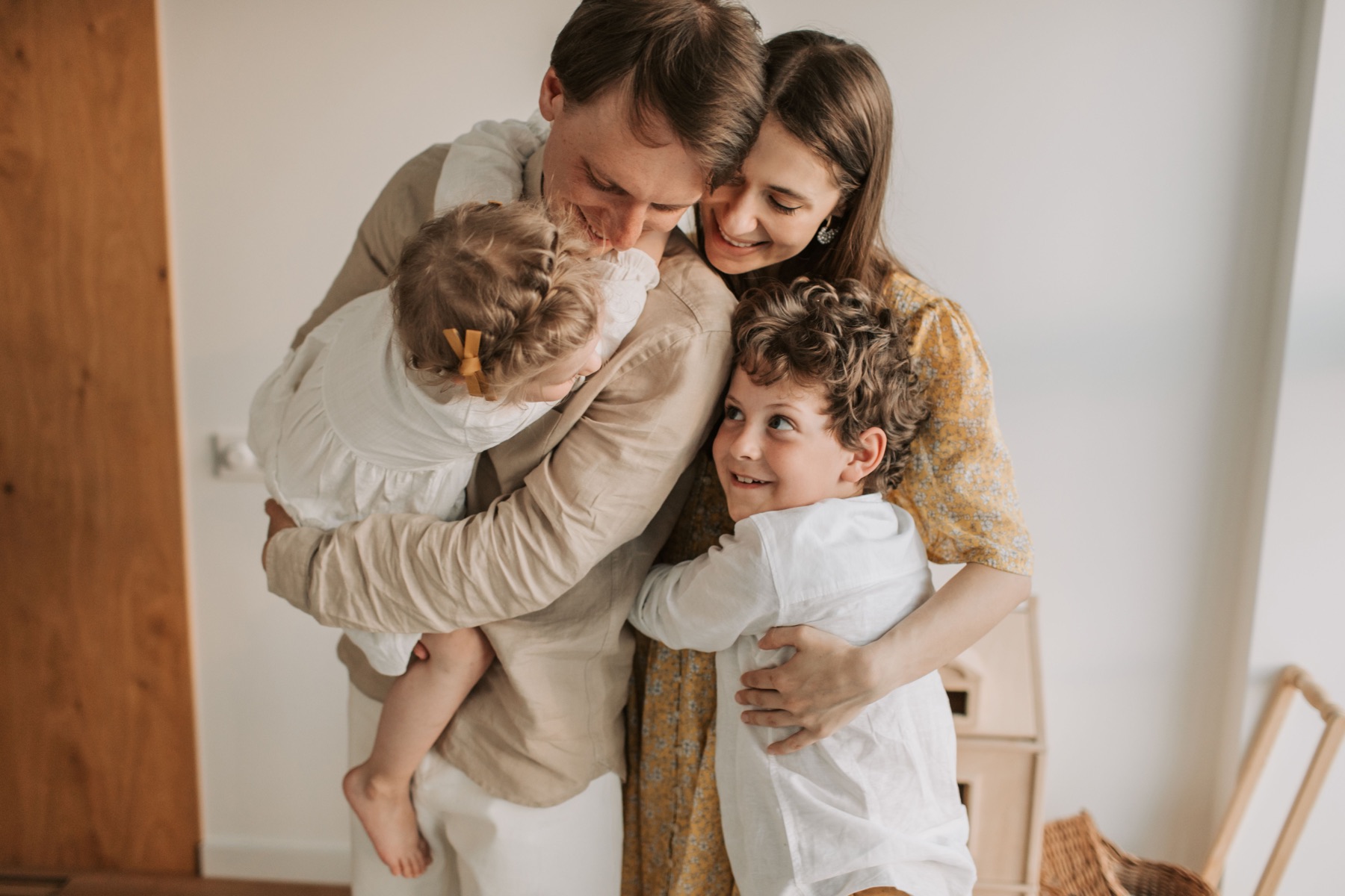 Family embracing together at home